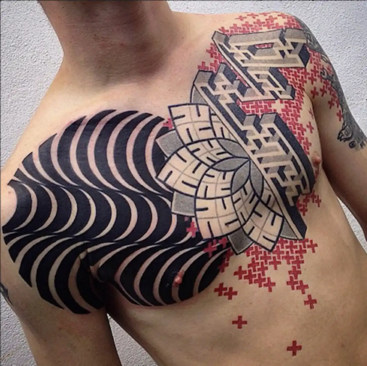 There is a tremendous amount of bone in the chest. Unless you’re really working on those pectorals, the skin is going to be thin and directly against that boney chest area. Oh, and did we mention that the needles vibrations will suddenly be a hell of a lot more noticeable this time around? Yowza! (Tattoo by Marco Galdo)