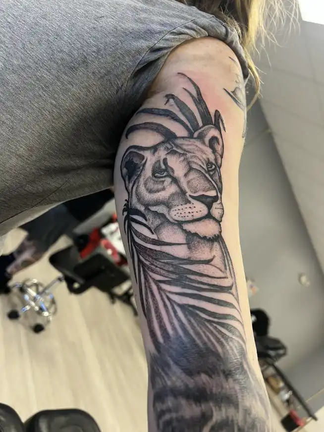 lioness tattoo black and grey
